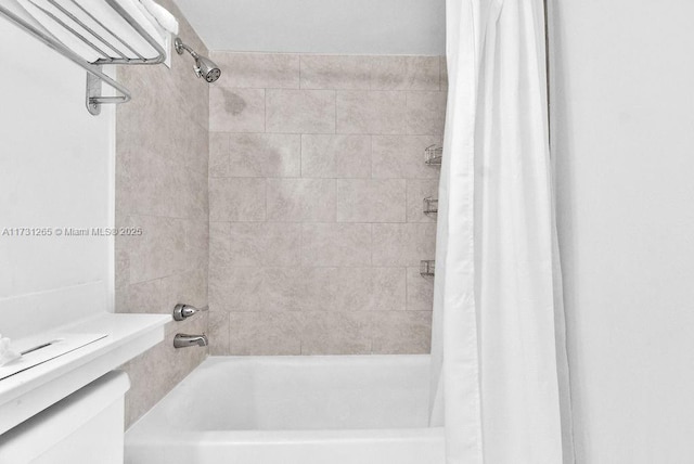 bathroom featuring shower / tub combo with curtain