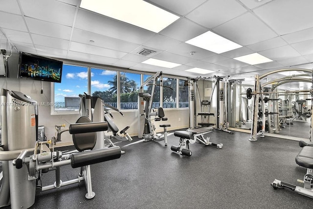 workout area featuring a drop ceiling