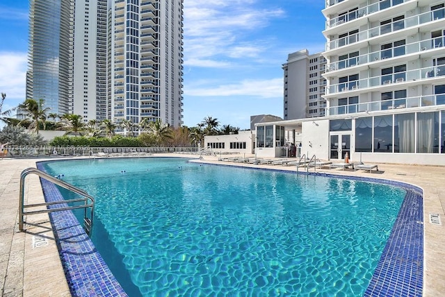 view of swimming pool with a patio area