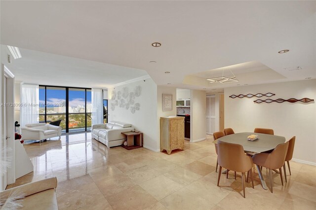 dining space featuring a wall of windows