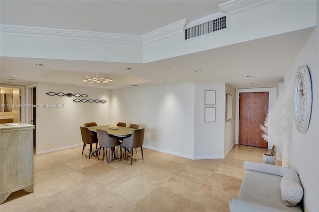 dining room featuring ornamental molding