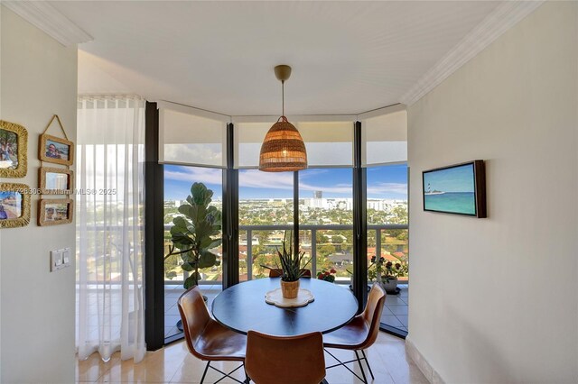 dining area featuring expansive windows and crown molding