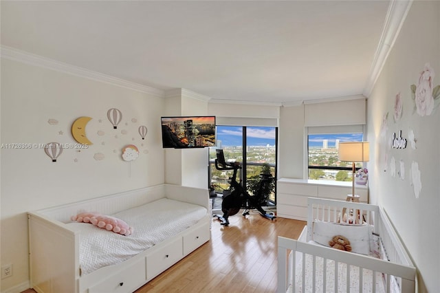 3600 Yatch Club Dr Unit 1701, Aventura, FL 33180 - bedroom featuring crown molding and light hardwood / wood-style flooring