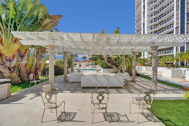 view of patio / terrace featuring an outdoor living space, a community pool, and a pergola