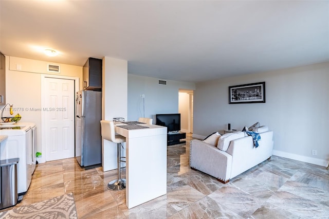 living room featuring washer and dryer