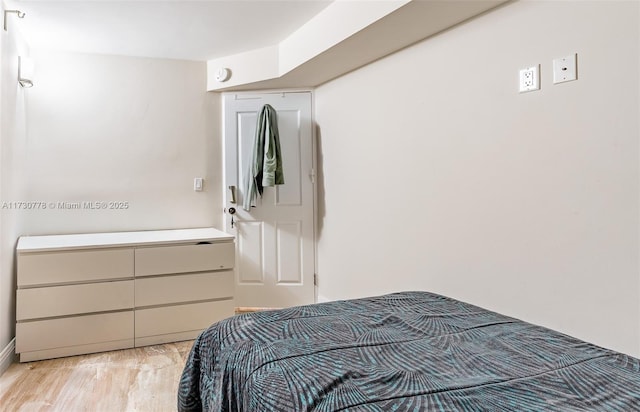 bedroom with light wood-type flooring