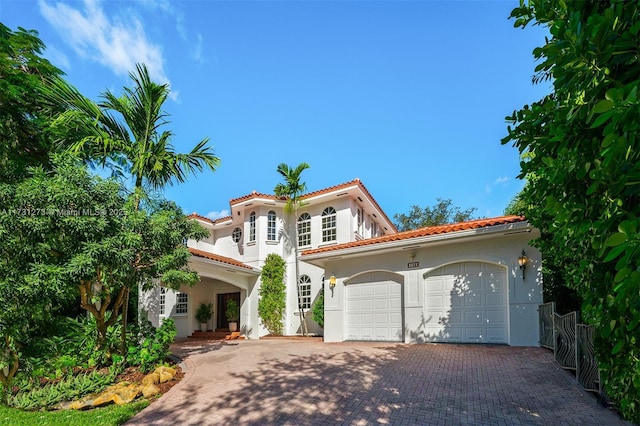 mediterranean / spanish-style home featuring a garage