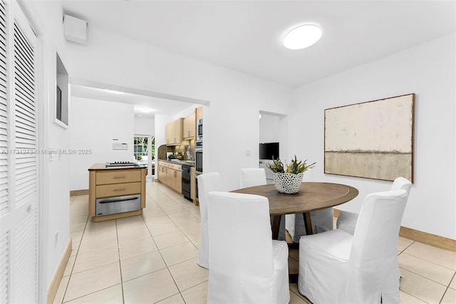 dining area featuring light tile patterned floors