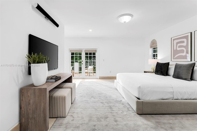 bedroom featuring access to exterior and french doors