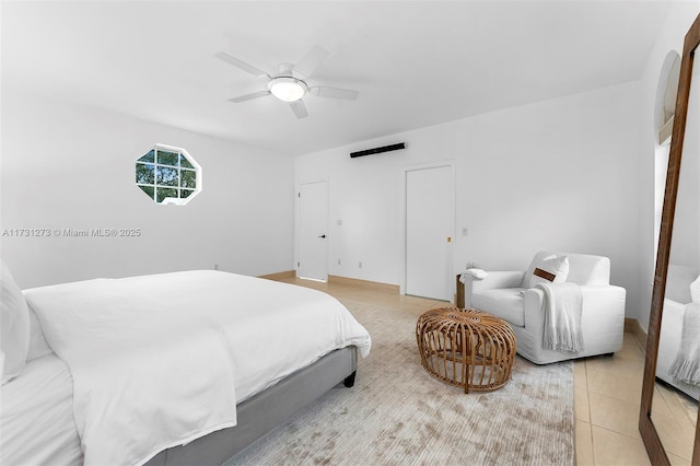 tiled bedroom with ceiling fan