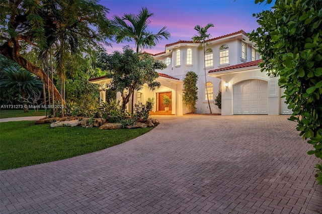 mediterranean / spanish-style house featuring a yard