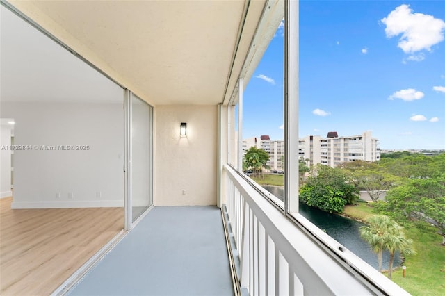 balcony featuring a water view