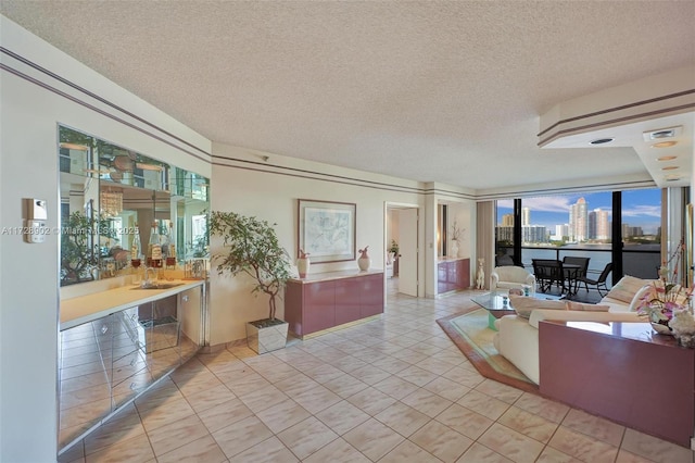 tiled living room featuring bar area and a textured ceiling