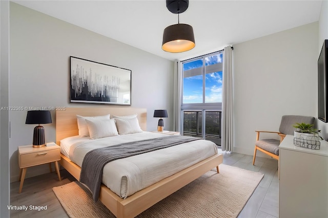 bedroom with light wood-type flooring