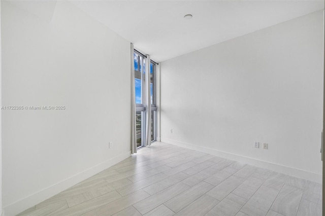 empty room featuring floor to ceiling windows