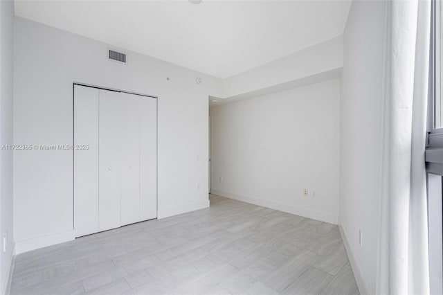 unfurnished bedroom featuring a closet