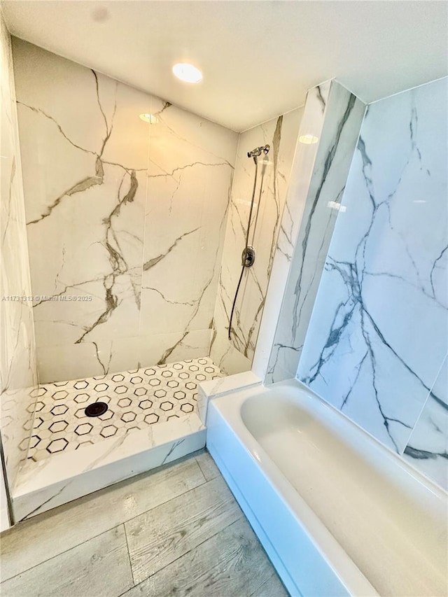 bathroom featuring hardwood / wood-style flooring and independent shower and bath