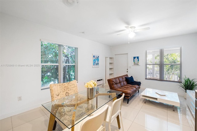 tiled dining area with ceiling fan