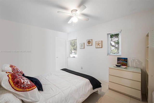 bedroom with light tile patterned flooring and ceiling fan