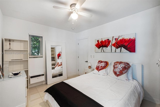 tiled bedroom with ceiling fan and a wall mounted air conditioner