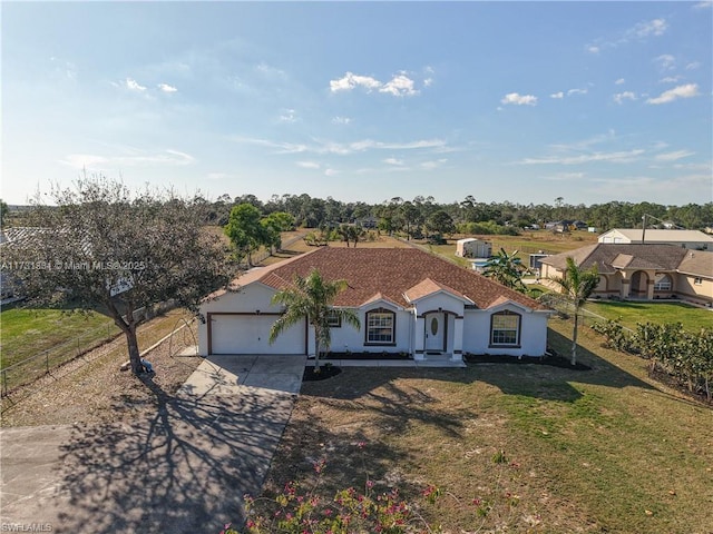 view of front of house with a garage and a front yard