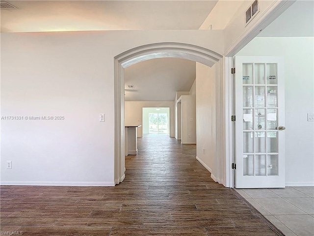 hall with wood-type flooring