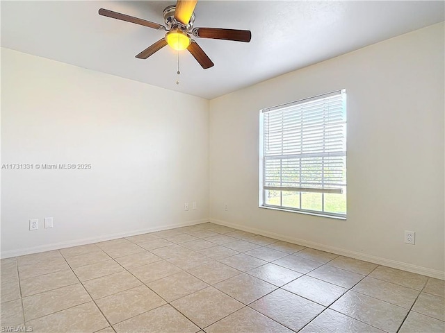 unfurnished room featuring light tile patterned floors and ceiling fan