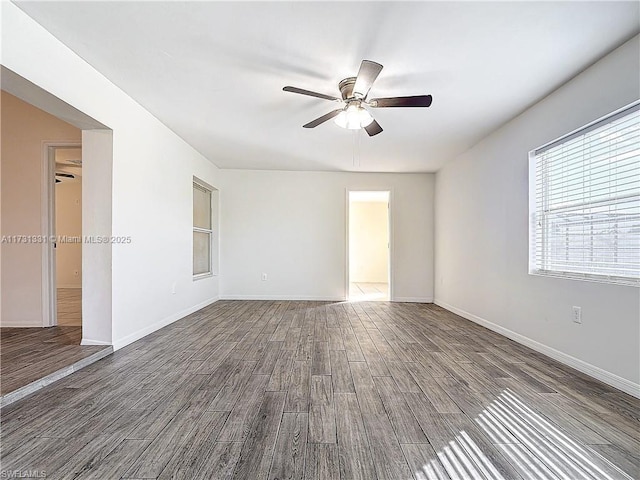 unfurnished room with ceiling fan and hardwood / wood-style floors