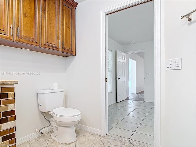 bathroom featuring tile patterned floors and toilet