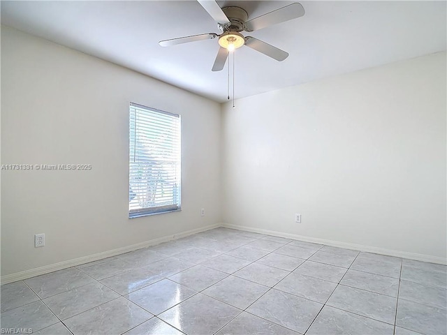 tiled empty room with ceiling fan