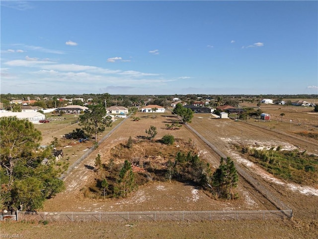 birds eye view of property featuring a rural view