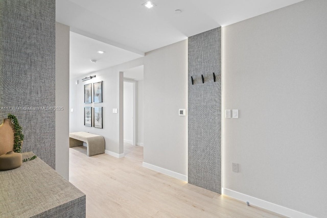 interior space with recessed lighting, baseboards, and light wood finished floors