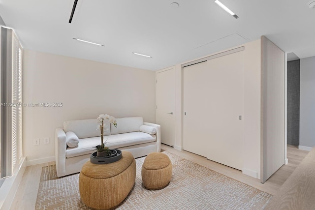 sitting room featuring light hardwood / wood-style floors