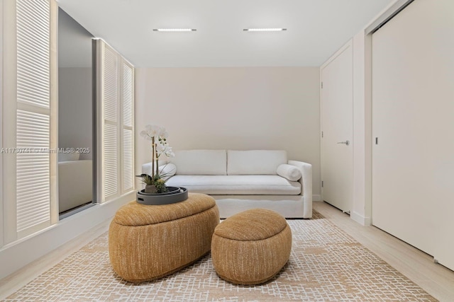 sitting room with hardwood / wood-style floors