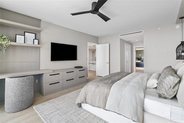 bedroom with ceiling fan and light wood-type flooring