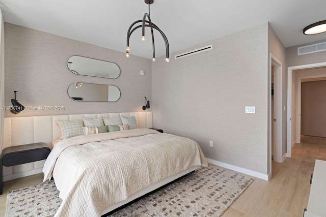 bedroom with light wood-type flooring