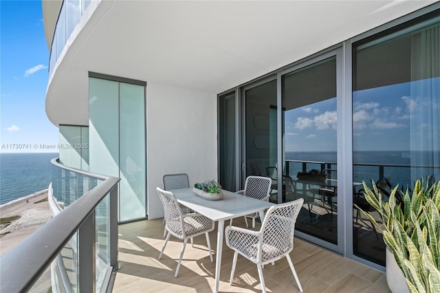 balcony featuring a water view