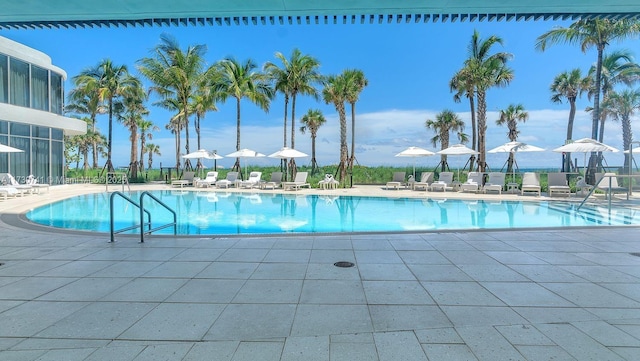 community pool with a patio area