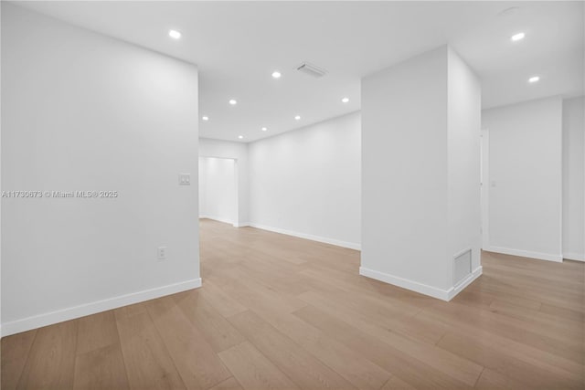 spare room featuring light hardwood / wood-style floors