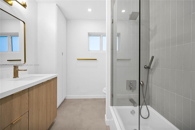 full bathroom featuring vanity, tile patterned flooring, toilet, and combined bath / shower with glass door