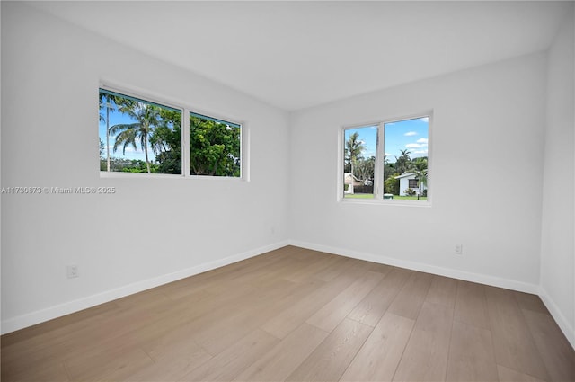 spare room featuring light hardwood / wood-style floors