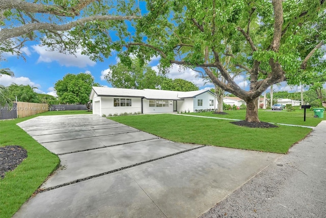 single story home featuring a front yard