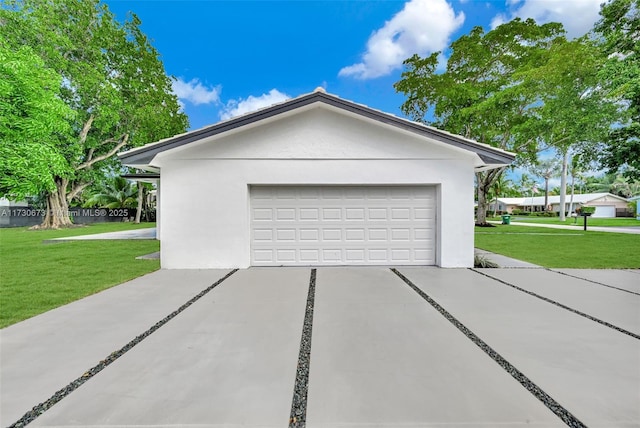 view of home's exterior with a garage and a yard