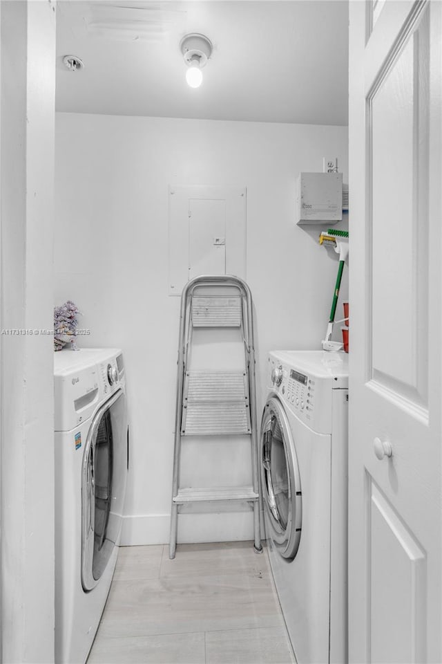 laundry room featuring washing machine and dryer and laundry area