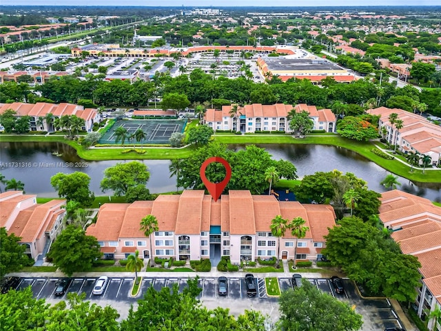 bird's eye view with a water view and a residential view