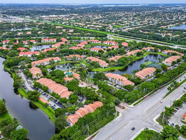 birds eye view of property featuring a water view and a residential view