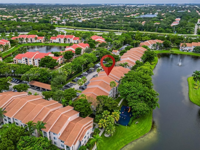 birds eye view of property featuring a water view and a residential view