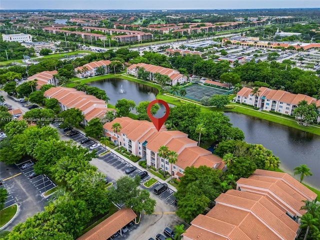 bird's eye view with a water view and a residential view