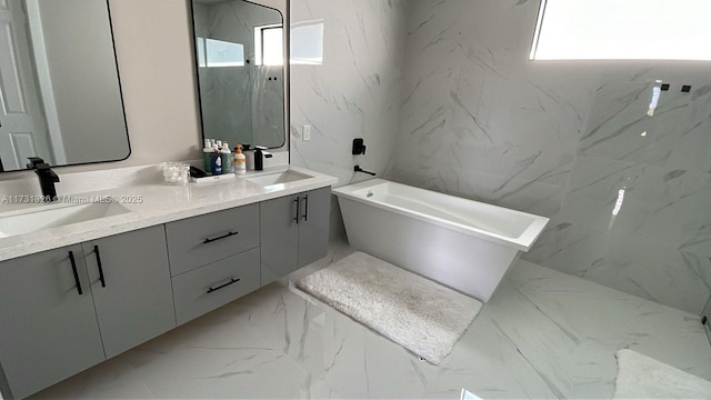 bathroom featuring vanity and a bathing tub