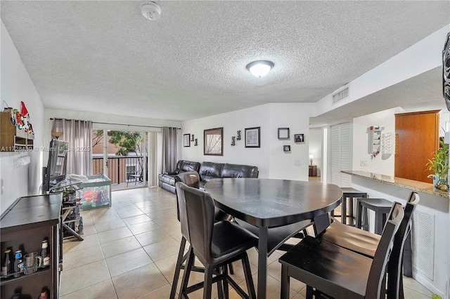 dining space with light tile patterned flooring